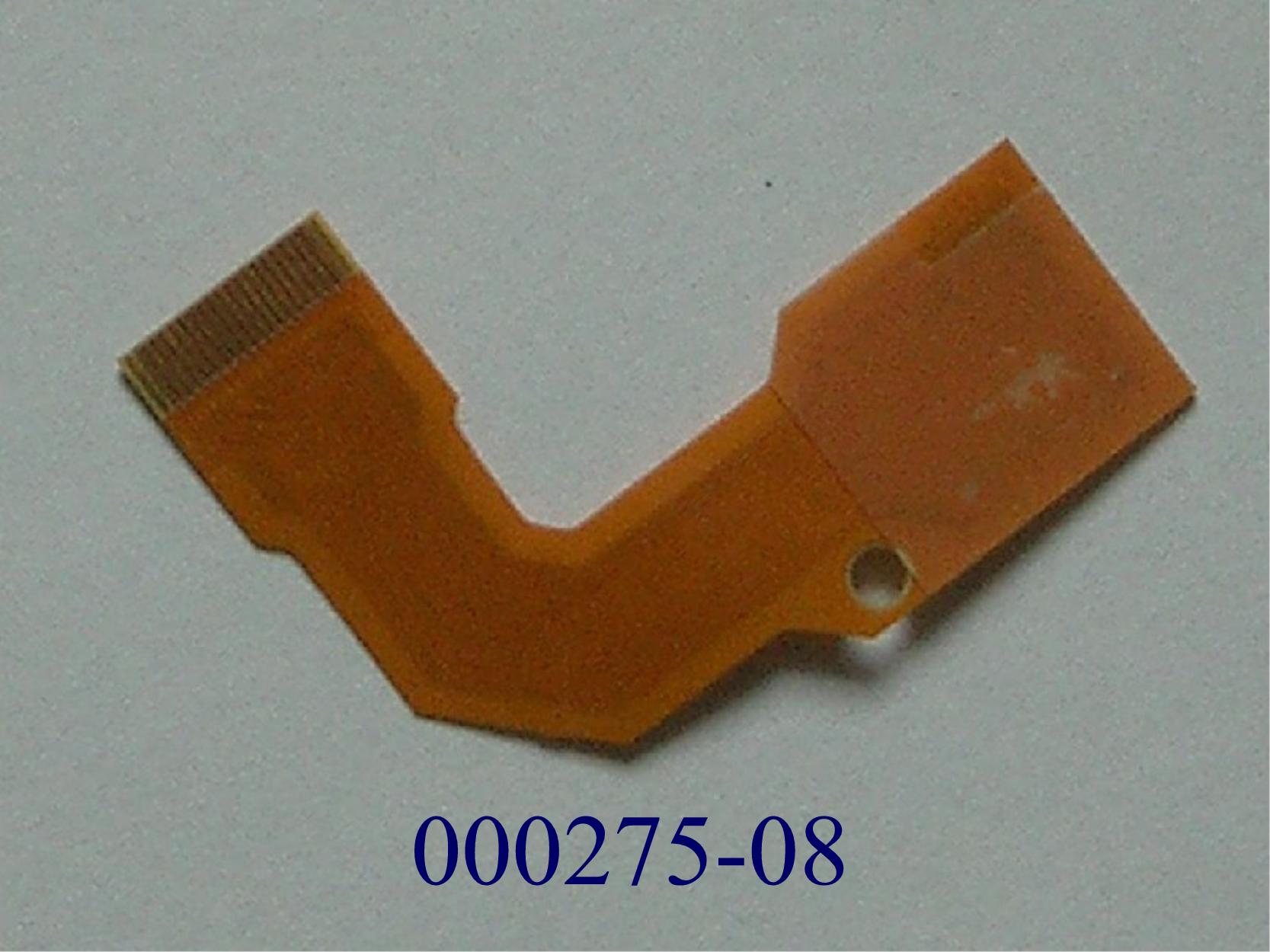 Leiterplatte,
- in Form einer mehrlagigen gedruckten Schaltung mit Leiterbahnen und Kontakten.
- mit den Abmessungen ca. 40 x 30 x 0,3 mm.
- L-förmige, in Form von Mehrlagenschaltung ausgeführte und flexible Leiterplatte (Folienstück) aus Polyamid mit mehreren mit Kontaktstellen versehenen Bereichen, die über isolierte Leiterbahnen elektrisch leitend verbunden sind. Das Folienstück ist mit einer Ausnehmung versehen.
- Ohne diskrete Widerstände, Kondensatoren, Induktionsspulen und Bauelemente, die ein elektrisches Signal erzeugen, umformen, verändern oder verstärken.
(Abbildung siehe Anhang)

"Gedruckte Schaltung, nur mit Leiterbahnen oder Kontakten – Mehrlagenschaltung"