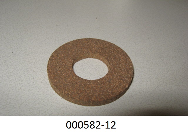 Eine 3 mm starke Dichtungsscheibe, unterschiedlich braun gesprenkelt, mit einem Außendurchmesser von 32 mm und einem Innendurchmesser von 14 mm, aus Presskork mit einem Bindemittel hergestellt.
(Material lt. Antragsteller)
(Abbildung siehe Anlage)