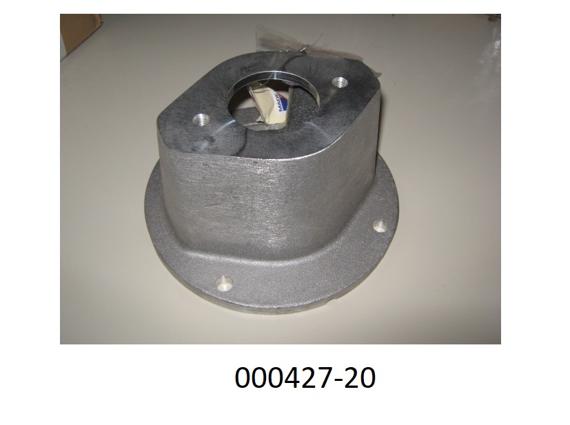 Erkennbarer silberfarbener Teil einer Flüssigkeitspumpe (Gehäuse) aus legiertem Aluminium mit runder Bodenplatte und einem annähernd trapezförmigem (Seitenansicht) Oberteil, durch Gießen hergestellt und nachträglich mit Bohrungen, Öffnungen (rund und annähernd rechteckig) und Kabelkanälen versehen.
(Abbildung laut Anlage)
