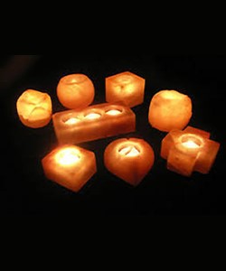 Articles of Himalayan rock salt in various shapes with space for placing  tealights. They do not have any specific fitting for holding the tea light.