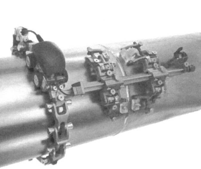 Dle deklarovaných údajů a předložené fotodokumentace se jedná o kovový mechanický nástavec, kombinovaný s plastem
Slouží pro upevnění ultrazvukových sond (sondy nejsou předmětem této ZISZ) a jejich přesné vedení po povrchu potrubí. Nástavec umožňuje plynulé pootáčení ultrazvukových sond (sondy slouží pro nedestruktivní kontrolu svárových spojů potrubí) kolem obvodu zkoušeného potrubí