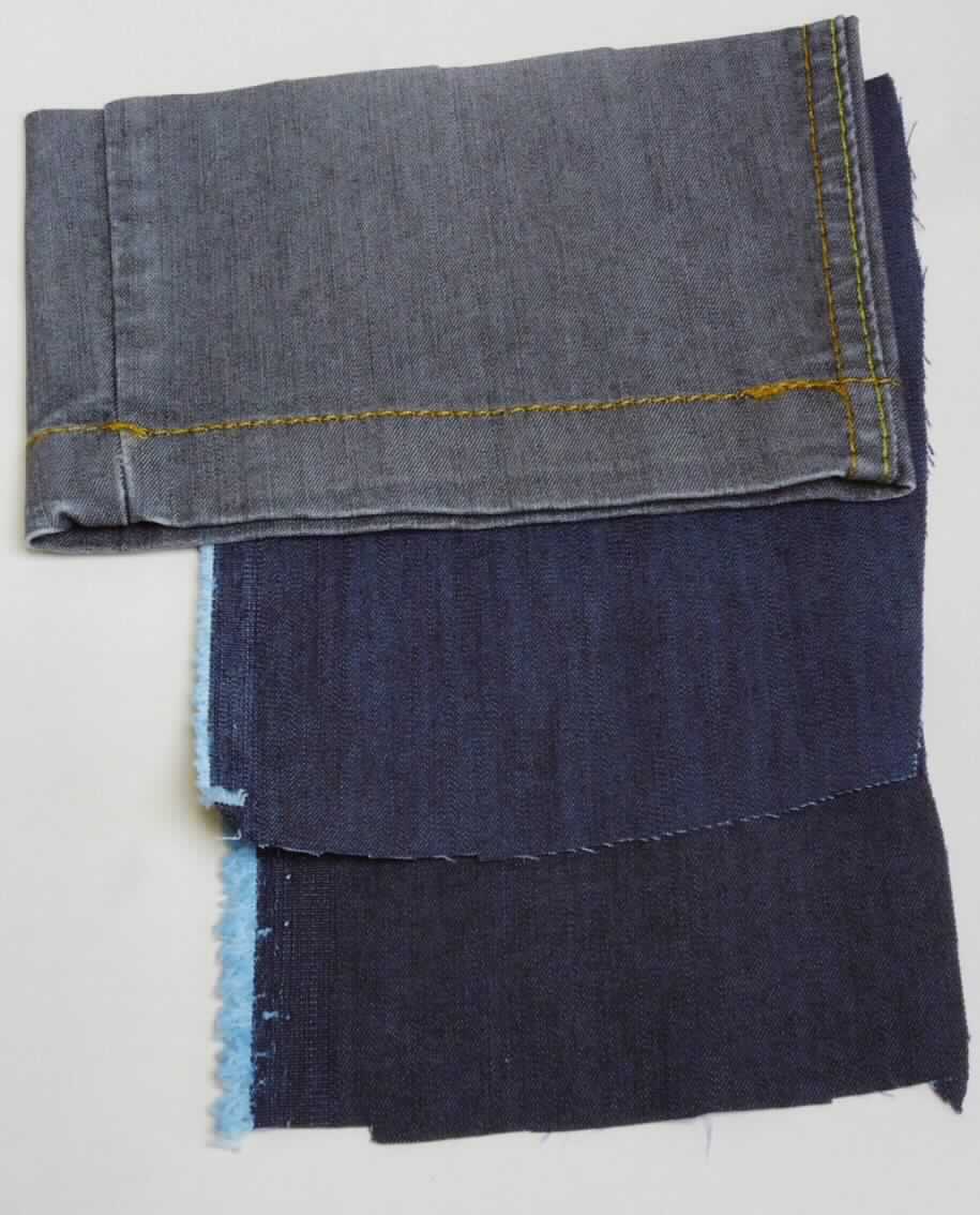 Denimgewebe, Foto siehe Anlage,
- als Meterware mit einer Breite von laut Antrag mehr als 30 cm,
- buntgewebt, in Kettköperbindung (3-bindig),
- aus blauen bzw. schwarzen Kettfäden und weißen Schussfäden aus Garnen aus Spinnstoffen,
- laut Antrag:
-- aus 71 GHT Baumwolle, 27 GHT Polyester und 2 GHT Lycra (beides synthetische Chemiefasern),
-- mit einem Quadratmetergewicht von 220 g, 
- nicht auf Handwebstühlen hergestellt.

"Gewebe aus Baumwolle, mit einem Anteil an Baumwolle von weniger als 85 GHT, ausschließlich mit Chemiefasern 
 gemischt, mit einem Quadratmetergewicht von mehr als 200 g, buntgewebt, Denim, nicht auf Handwebstühlen 
 hergestellt"