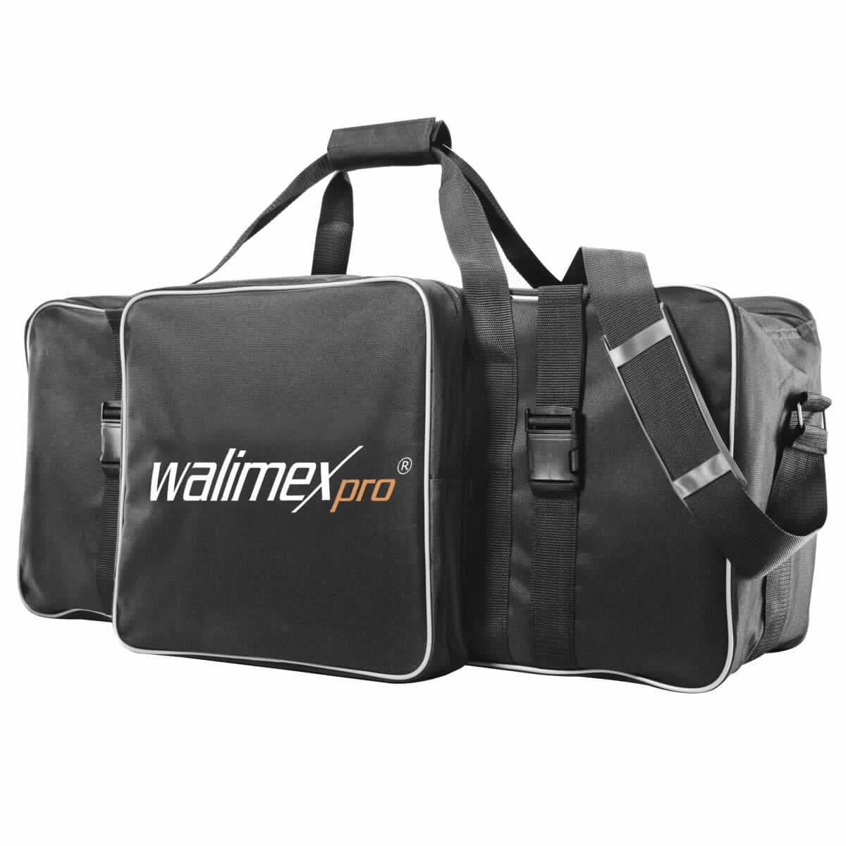 Handkofferähnliches Behältnis, sog. walimex pro Studiotasche XL, Art.-Nr. 14881, Abbildung siehe Anlage, 
- mit einer Außenseite aus Spinnstoffen, 
- mit zwei angenähten Handtragegurten und einem abnehmbaren, verstellbaren, gepolsterten Schultertragegurt, 
- auf der Vorderseite mit einem großen Fach mit Reißverschluss, 
- Hauptfach mit zwei parallel geführten Reißverschlüssen auf der Oberseite sowie zwei verstellbaren Gurtbändern 
  mit Schnappverschluss zu öffnen, 
- - innen mit zwei Trennstegen mit Klettbändern zum individuellen Gestalten des Innenraumes, vollständig 
    gepolstert und gefüttert, 
- formstabil, mit den Abmessungen von ca. 75 (L) x 21 (B) x 30 (H) cm, 
- zum Transport der Studioausrüstung eines Fotografen bestimmt, 
- keine Hinweise auf Handarbeit.

"Handkofferähnliches Behältnis, mit Außenseite aus Spinnstoffen, nicht handgearbeitet"