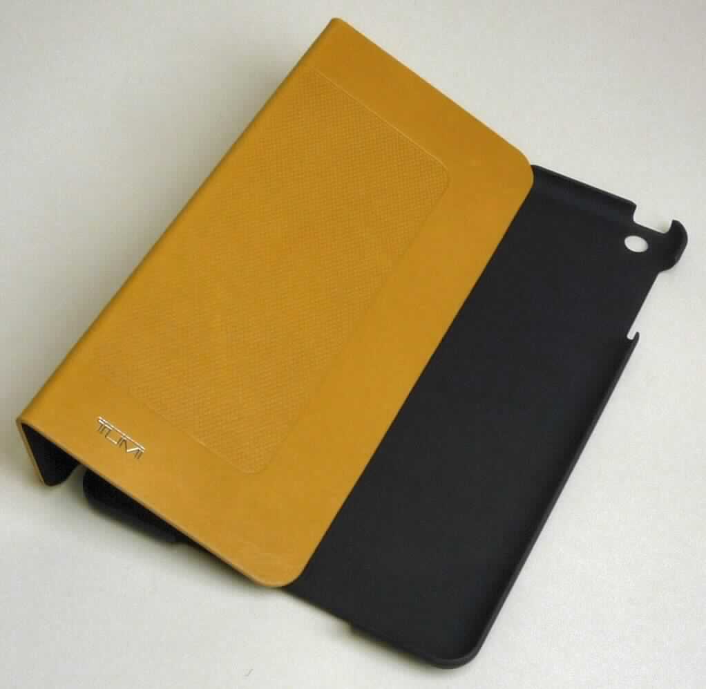 Etuiähnliches Behältnis, sog. Tumi Leather Snap Case for IPad MINI, Art.-Nr. 014267TN-RD, Abbildung siehe 
Anlage, 
- mit einer flächenmäßig überwiegenden, charakterbestimmenden Außenseite aus Leder (Deckel) und formge- 
  presstem Kunststoff (Kunststoffschale), 
- die Schale aus formgepresstem Kunststoff ist passgenau zur Aufnahme eines Tablet-PC gestaltet, 
- rechteckig, mit den Abmessungen von ca. 20,5 (L) x 14 (B) x 1 (T) cm, 
- ohne Verschluss, 
- zur Bedienung des IPads mit mehreren Öffnungen versehen, innen einseitig gefüttert, 
- dient dem Transport und der Aufbewahrung eines Tablet-Computers und kann zusätzlich aufgeklappt als Aufstell- 
  vorrichtung genutzt werden, 
- keine Hinweise auf Handarbeit, 
- verpackt in einer handelsüblichen Verkaufsumschließung. 

"Etuiähnliches Behältnis, anderes als in den Unterpositionen 4202 1110 bis 4202 3900 genannte, mit Außenseite 
 aus Leder, anderes als in der Unterposition 4202 9110 genannte, nicht handgearbeitet"