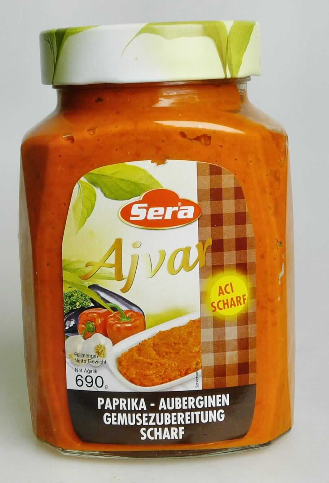 Ajvar.

Antragsangaben (als zutreffend unterstellt): Aci Ajvar Kvnz. (12 x 720 ml), Art.-Nr. 0305 001. Zusammensetzung: Rote Paprika (82,3 %), Auberginen (7,4 %), Knoblauch, Sonnenblumenöl, Salz, Branntweinessig (1,9 %), Zucker. 

Äußere Beschaffenheit des vorgelegten Warenmusters: Aufmachung: Original-Schraubglas mit einem Nettogewicht von 690 g. Warenaufschrift, auszugsweise: "Sera, Ajvar, Paprika-Auberginen Gemüsezubereitung scharf." Inhalt: Rot-orangefarbene, inhomogene, musartige Masse mit Schalenbestandteilen und Paprikakernen und kleinen Auberginenstückchen, einem scharfen Ajvar entsprechend schmeckend. 
Gehalt an freier flüchtiger Säure i. S. der ZAnm 1 zu Kap 20 (gemäß Angabe): weniger als 0,5 GHT.

Anderes Gemüse, anders als mit Essig oder Essigsäure zubereitet oder haltbar gemacht, nicht gefroren, ausgenommen Erzeugnisse der Position 2006, Mischungen von Gemüsen, nicht in Form von Pulver.