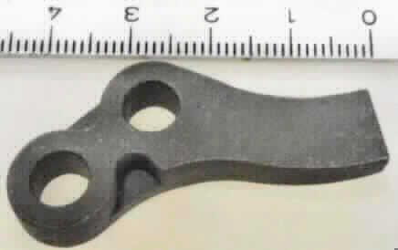 Teil für ein Kraftrad, sog. Anschlagstück, Foto siehe Anlage,
- spezifisch geformtes Erzeugnis aus (lt. Antrag) Stahlguss, 
- mit zwei Bohrungen versehen,
- wird an einer Kickstartvorrichtung eines Kraftrades oder Mopeds verbaut,
- erkennbares Teil zur ausschließlichen Verwendung an Krafträdern.

"Teil für ein Kraftrad der Position 8711 (Anschlagstück)"