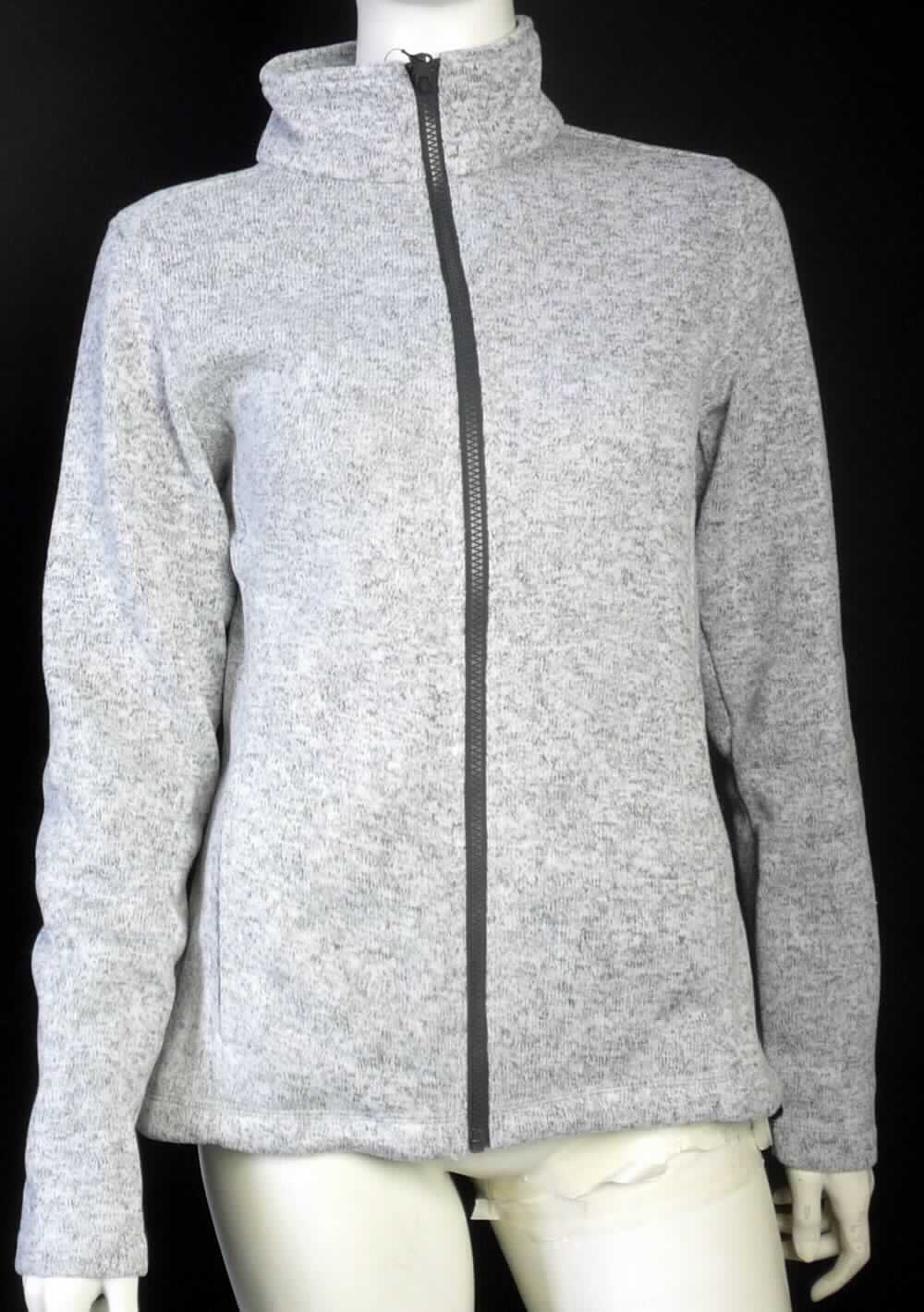 Jacke, sog. Women`s knit Fleece Jacket, Art. 7725, Größe S, Foto siehe Anlage,
- aus ca. 1,7 mm dicken, einseitig (Innenseite) gerauten, buntgewirkten Gewirken (melierte Garne) aus laut 
  Antrag 100 % Polyester (synthetische Chemiefasern),
- über die Taille reichend (Rückenlänge: ca. 66 cm), 
- mit einem Stehkragen,
- mit einer durchgehenden Öffnung mit Reißverschluss,
- ohne Hinweise auf den Trägerkreis (unisex),
- mit langen Ärmeln, an den Ärmelenden gesäumt,
- vorn mit zwei eingesetzten, offenen Taschen unterhalb der Taille,
- in Längsbahnen gearbeitet,
- am unteren Rand durch Umschlagen und Festnähen gesäumt,
- stellt sich aufgrund des Schnitts als Jacke dar, somit keine Strickjacke.

"Jacke, aus Gewirken, für Frauen, aus synthetischen Chemiefasern"