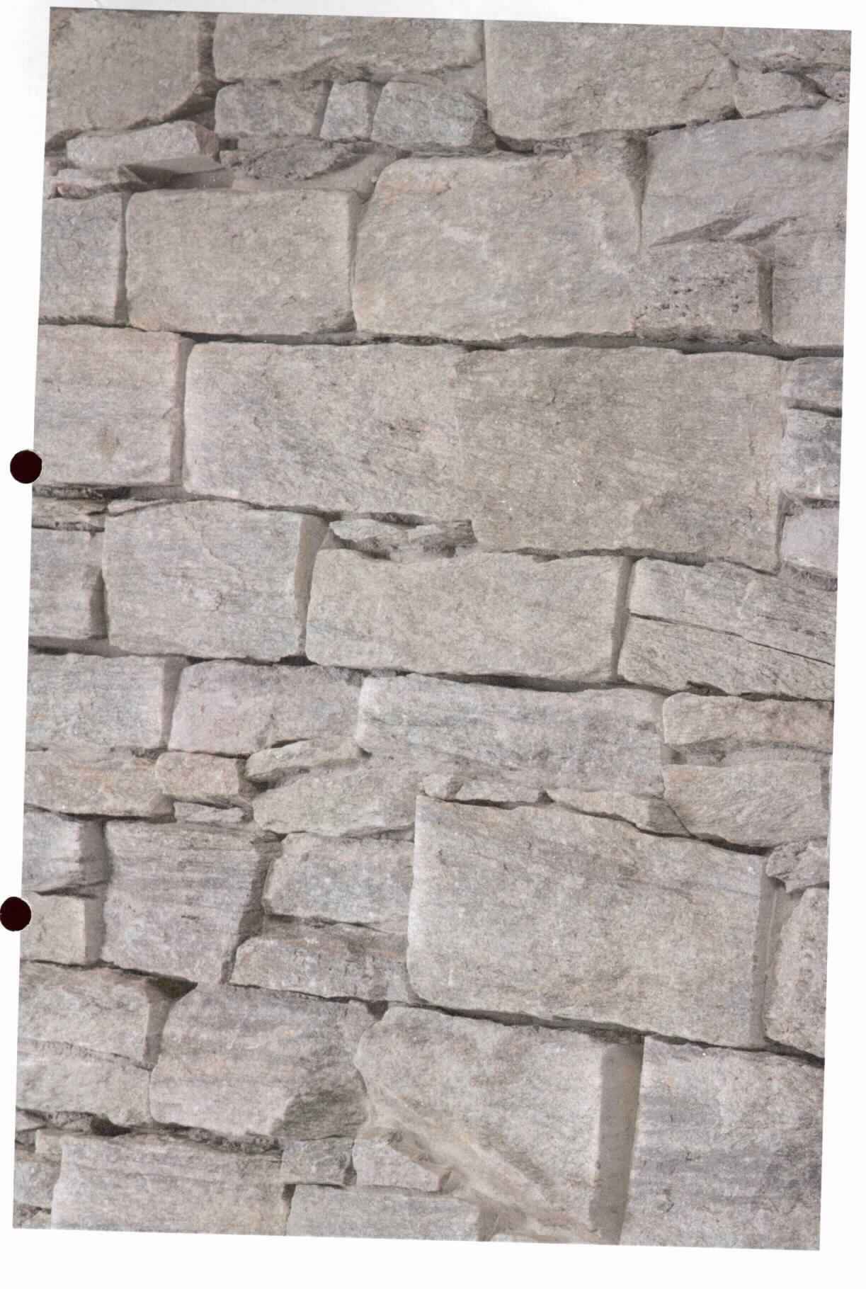 Angaben:
Verblender DOMINICA ROX 
Bearbeitung: Oberfläche spaltrau, Seiten bruchrau, als System verklebt, zur einfachen Montage S-Typ, Rückseite gesägt & eben 
Farbe: grau-braun 
Material: Quarzit 
Herkunft: China 
Größe: 56/61 x 15,2 x 3-4 cm 80 kg / qm

Befund:
Bearbeitete Werksteine und Waren daraus