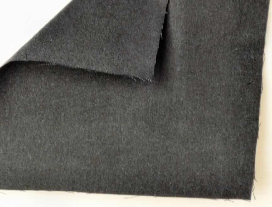 Gewebe, sog. Gewebe Nomex Outershell Tough, Foto siehe Anlage,
- als Meterware,
- laut Antrag:
-- aus Aramidfasern (synthetische Spinnfasern),
-- buntgewebt (melierte Garne).

"Gewebe aus synthetischen Spinnfasern (Aramid), mit einem Anteil an diesen Spinnfasern von mehr als 85 GHT, 
 buntgewebt"