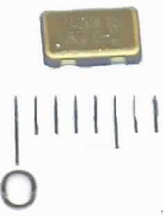 Piezoelektrischer Kristalloszillator, O 12.0 - JO53
- mit einer festen Frequenz von 12,0 MHz, 
- aus einem mit aktiven und passiven  Bauelementen (Kondensator, monolithische
  integrierte Schaltung, Schwingquarz) bestückten Keramikträger,
- in einem Keramikgehäuse mit einer Kennzeichnung und 4 Anschlüssen.

"Elektrisches Gerät mit eigener Funktion, in Kapitel 85 anderweit weder genannt noch
 inbegriffen; Piezoelektrischer Kristalloszillator mit einer festen Frequenz in einem
 Frequenzbereich von 1,8 MHz bis 67 MHz, in einem Gehäuse"