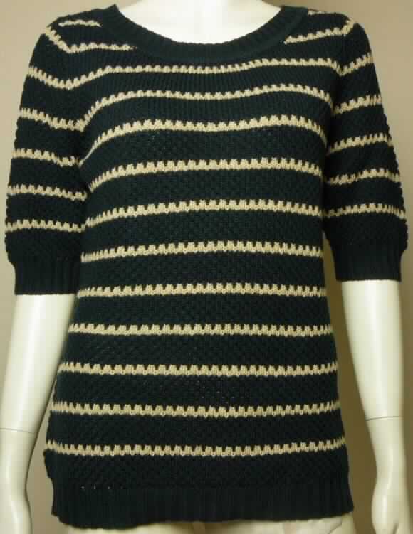 Pullover, sog. Serafini Strickpullover taupe / weiß, Art. 231250, Größe 38, Foto siehe Anlage,
- aus ca. 2,6 mm dicken, buntgestrickten Gestriken aus lt. Antrag 55 % Leinen und 45 % Baumwolle,
- über die Taille reichend (Rückenlänge: ca. 62 cm),
- mit einem halsfernen, runden Halsausschnitt,
- vorn ohne Öffnung und ohne Verschluss, 
- mit kurzen Ärmeln, 
- am unteren Rand mit einem verengenden Bund.

"Pullover, aus Gestriken, aus Leinen"