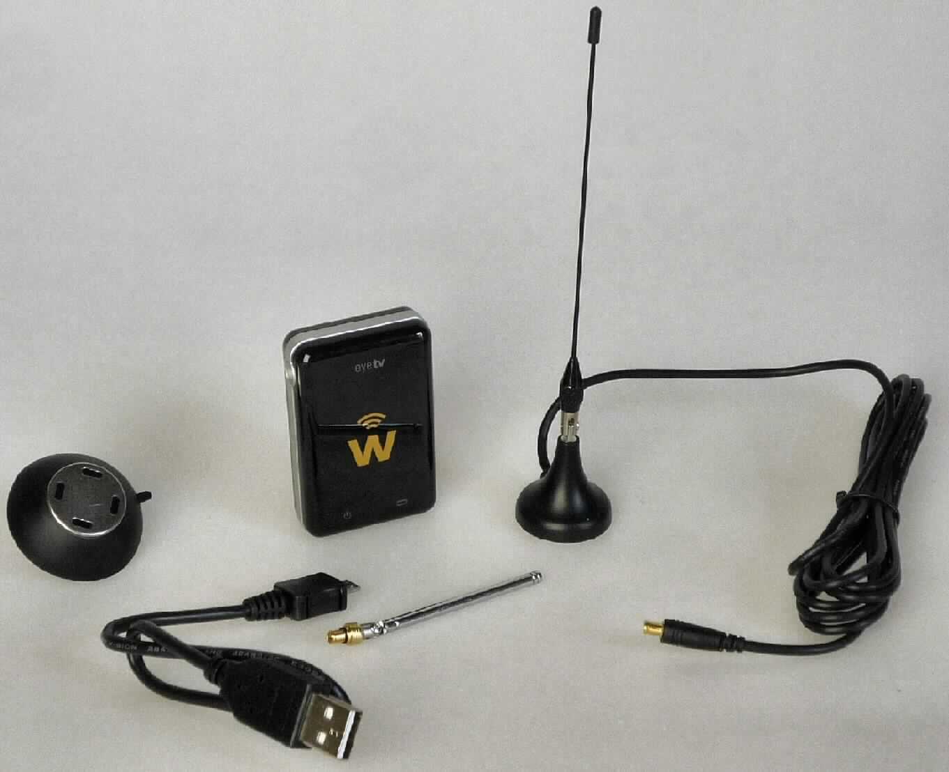 EyeTV W DVB-T Receiver/Streamer
- aus einem DVB-T Tuner, WLAN-Modul und Akkumulator in einem Gehäuse (Abmessungen:
  64 x 42 x 16 mm) mit USB-Schnittstelle und integrierter WLAN-Antenne (Abbildung siehe Anlage),
- zum Empfangen von digitalen terrestrischen Fernsehprogrammen (DVB-T) und zum Senden
  dieser Fernsehprogramme in einem drahtlosen Netzwerk,
- zusammen mit Beipack (Ladekabel, Stabantenne, Mini-Teleskopantenne, Benutzerhandbuch) in gemeinsamer 
  Verkaufsumschließung.
Der Fernsehsender/-empfänger bestimmt den Charakter des Ganzen.

"Sendegerät für das Fernsehen mit eingebautem Empfangsgerät, in Warenzusammenstellung
 mit nicht charakterbestimmendem Beipack"