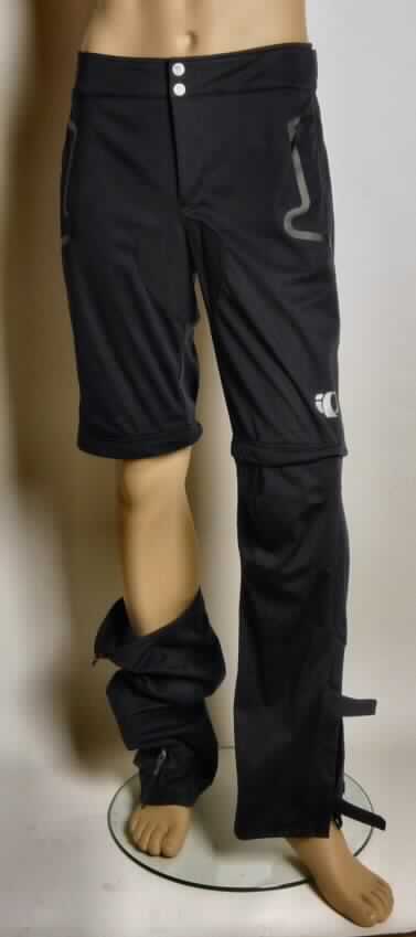 Lange Hose, sog. Herren Radsporthose Elite Softshell Zip OFF Pant, Art.Nr. 21111210, Gr. Medium,
Foto siehe Anlage,
- aus 0,7 mm dicken, einfarbigen Gewirken aus lt. Antrag 100 % Polyester (synthetische
  Chemiefasern),
- in der Taille abschließend mit einem teilweise elastischen sowie mit zwei Klettverschlüssen 
  verstellbaren Taillenbund,
- mit knöchellangen Hosenbeinen; oberhalb der Knie durch Reißverschluss abtrennbar,
- im Schritt- und Gesäßbereich mit einem aufgenähten Zuschnitt aus Geweben aus 100% 
  Polyester verstärkt; im Bereich der Köchel innen mit jeweils einem Zuschnitt aus Gewebe 
  (100% Polyester) und einem Reißverschluss versehen; durch jeweils zwei Klettverschlüsse
  in der Wadenweite verstellbar,
- vorn mit einer Öffnung mit Reißverschluss, mit zwei Knöpfen von links auf rechts zu 
  schließen (Männerkleidung),
- mit zwei mit Reißverschluss verschließbaren Einschubtaschen,
- an den Beinabschlüssen gesäumt.

"Lange Hose aus Gewirken, für Männer, aus synthetischen Chemiefasern"