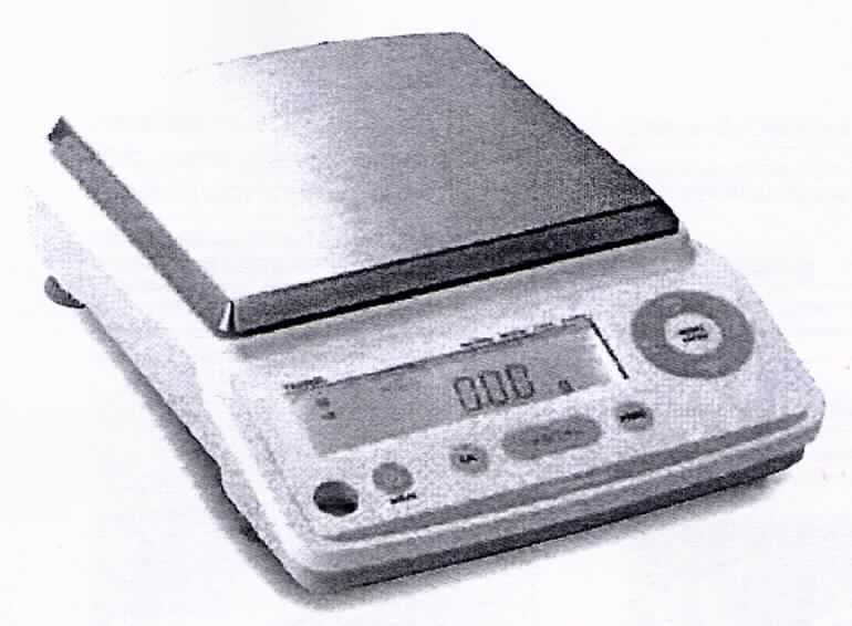 Die sog. "Analysewaage" besteht im Wesentlichen aus einem ca. 200 x 291 x 80 mm (B x T x H) messenden Gehäuse, mit LC-Display und Bedienelementen, und einer rechteckigen, 167 x 181 mm großen Wiegefläche.
Die Waage wiegt Waren bis zu einem Gewicht von 4200 Gramm bis zu einer Messgenauigkeit von 0,01 Gramm.

Die Ware wird als "Waage, mit einer Empfindlichkeit von feiner als 50 mg" eingereiht.