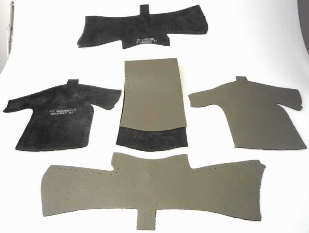 Lederzuschnitte, sog. Leather Cut Sets, Foto siehe Anlage,
- fünf verschiedene Lederzuschnitte (laut Antrag aus Rindleder),
- nach Schablonen aus Lederhäuten gestanzt,
- an den Rändern mit Löchern für das Vernähen versehen,
- werden auf das mit einem geschäumten Zellkunststoff zur Polsterung versehenen Lenkradgerüst 
  aus Magnesium geklebt und zusätzlich darauf vernäht,
- stellt sich erkennbar als unfertiges, noch nicht zusammengesetztes Teil eines Lenkrades für
  Kraftfahrzeuge dar; eine anderweitige Verwendung ist aufgrund des speziellen Zuschnitts 
  ausgeschlossen (keine Ware der Position 4205). 

"Teil für Kraftfahrzeuge der Position 8701 bis 8705, Teil für Lenkräder (Lederbezug), nicht für die industrielle Montage"