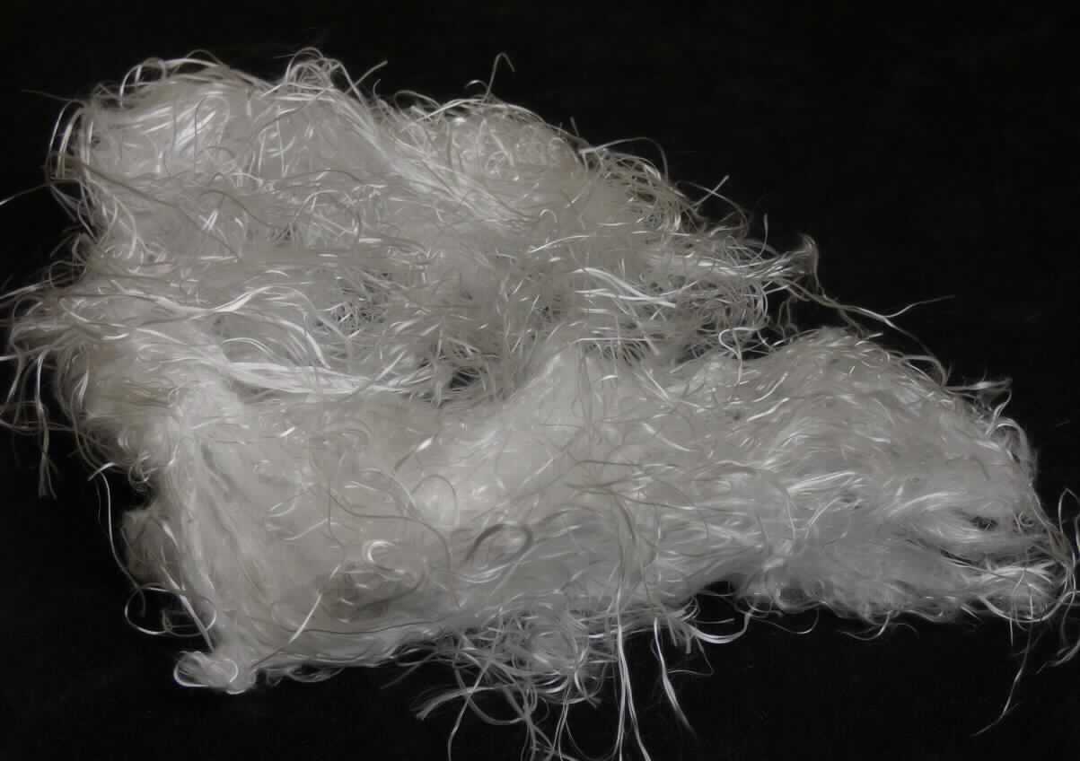 Glasfasern (Stapelfasern), sog. Silicafasern, 9 µm, 100 mm (+/- 25 %), Typ B, Foto siehe Anlage,
- textile Glasfasern (keine Filamente),
- - Silica-Fasern mit einem Gehalt an Siliciumdioxid (SiO2) von mindestens 96 GHT (laut Antrag),
- verwirbelte Stapelfasern aus weitgehend parallel gerichteten Elementarfilamenten geschnitten,
- mit einer Länge von ca. 80 mm (laut Antrag: 100 mm +/- 25 %),
- keine "chopped strands" der Unterposition 7019 1100, da mit einer Länge von mehr als 50 mm.

"Glasfasern, geschnittenes Textilglas, mit einer Länge von mehr als 50 mm, Stapelfasern"