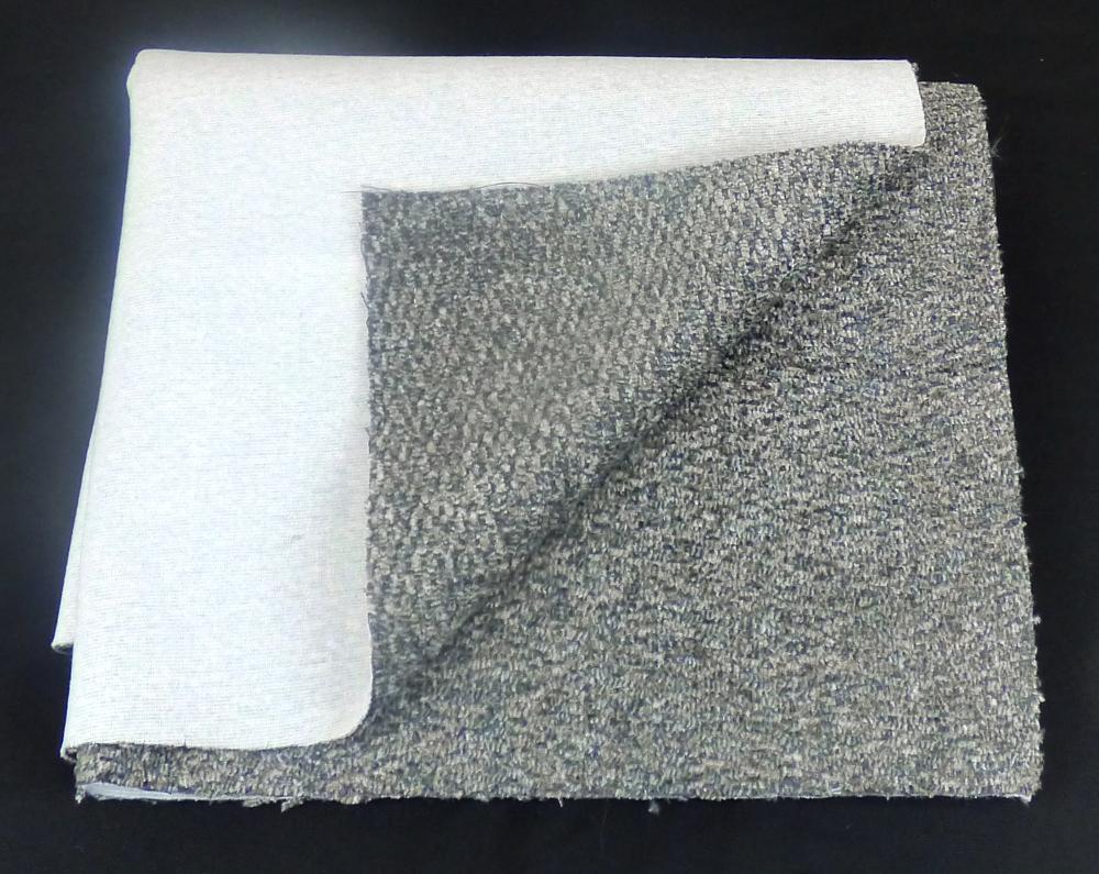 Textillaminat, sog. Möbelbezugsstoff für die Möbelindustrie, Art. Etna, Foto siehe Anlage,
- als Meterware, mit einer Breite von laut Antrag 141 cm,
- aus zwei mit ihrer ganzen Fläche aufeinander liegenden und so durch Kleben miteinander verbundenen
  Lagen:
-- mit einer Oberlage (Schauseite):
--- aus einem Chenillegewebe, 
---- aus Chenillegarnen und anderen Garnen; beide aus synthetischen Chemiefasern (laut Antrag
     Polyester),
---- mit samtartiger Oberfläche,
-- mit einer Unterlage:
--- aus einem einseitig gerauten Kuliergewirke,
--- aus synthetischen Chemiefasern (laut Antrag Polyester),
- das die Schauseite bildende Chenillegewebe verleiht der Ware insbesondere im Hinblick auf die
  Bedeutung in Bezug auf die Verwendung als Möbelbezugsstoff ihren wesentlichen Charakter.

"Chenillegewebe, keine Ware der Positionen 5802 oder 5806, aus Chemiefasern"