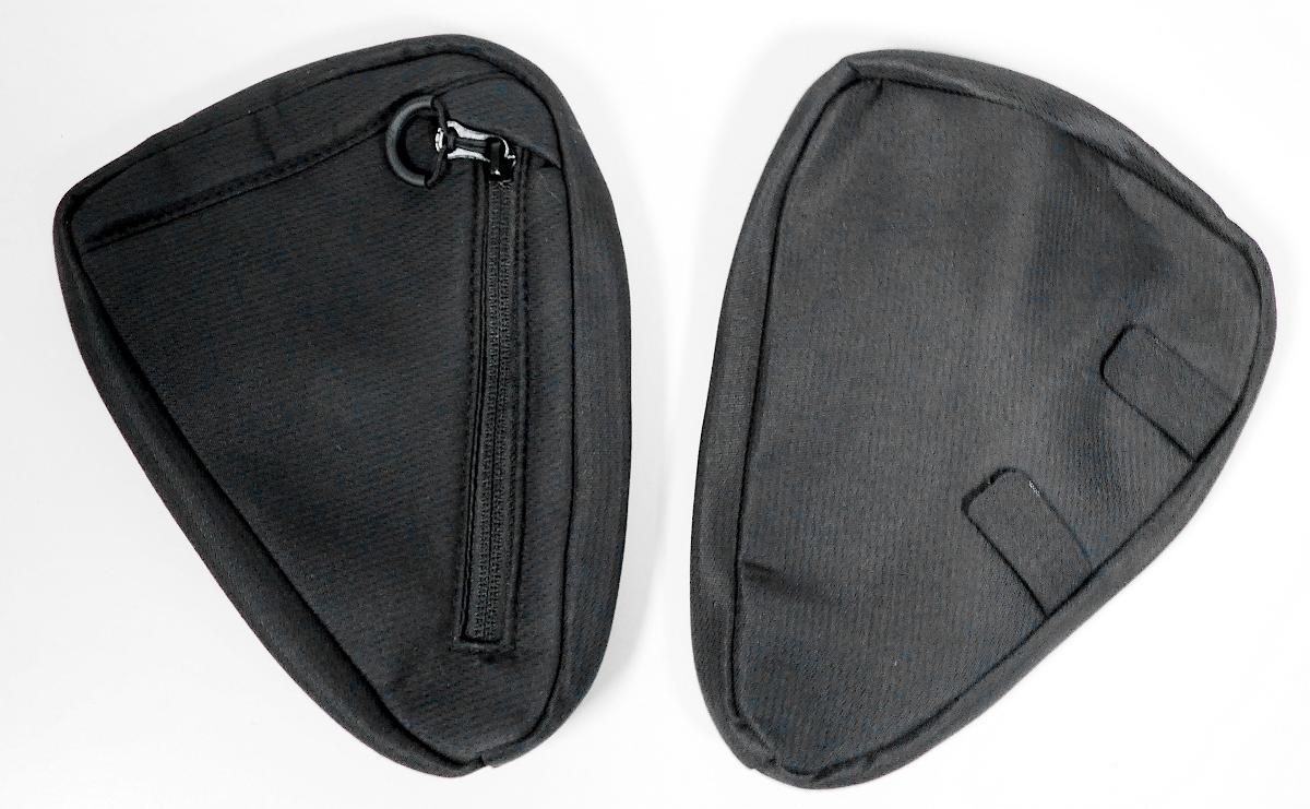 Ähnliches Behältnis, sog. Seitentaschen für den Kinderwagen, Fotos siehe Anlage,
- mit einer Außenseite aus Spinnstoffen,
- an der Rückseite mit zwei Klettverschlüssen zur Befestigung an der linken bzw.
  rechten Kinderwagenseite,
- an der Vorderseite mit einem schräg verlaufenden Reißverschluss,
- - gefüttert und gepolstert; ohne Inneneinteilung,
- annähernd dreieckig gearbeitet:
- - mit den Abmessungen: 22 cm (Breite) x 16 cm (Höhe) x 2 cm (Tiefe),
- ohne Hinweise auf Handarbeit.

"Ähnliches Behältnis, anderes als in den Unterpositionen 4202 1110 bis 4202 3900 genannte, 
  mit Außenseite aus Spinnstoffen, anderes als in der Unterposition 4202 9291 genannte,
  nicht handgearbeitet"
