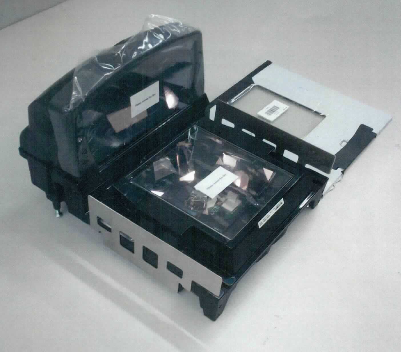 Barcodescanner, im Wesentlichen bestehend aus Sensorelektronik, LED-Lichtquelle und Elektronik zur Auswertung und Weitergabe der erfassten Daten in einem 399 x 292 x 230 mm großen Einbaugehäuse mit RS485-, RS232- und USB-Schnittstelle. Der Scanner dient dazu, verschiedene Datencodes, mit denen Waren gekennzeichnet sind, zu lesen und zu verarbeiten.

Die Ware wird als "optischer Leser" eingereiht.

Anlage: 1 Abbildung