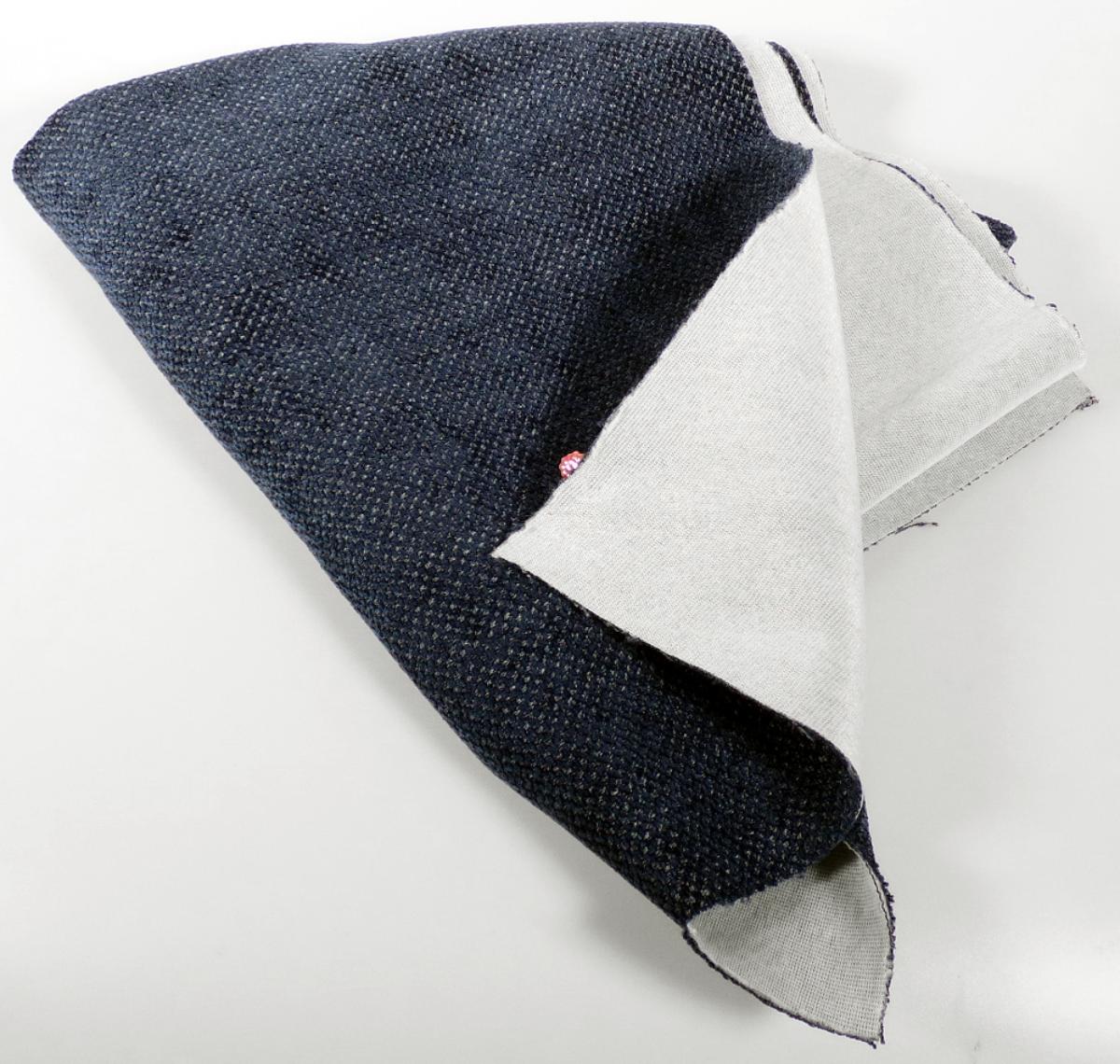 Textillaminat, sog. Möbelbezugsstoff, Foto siehe Anlage,
- als Meterware, mit einer Breite von mehr als 30 cm,
- aus zwei mit ihrer ganzen Fläche aufeinander liegenden und so durch Kleben miteinander verbundenen
  Lagen:
-- mit einer Oberlage (Schauseite):
--- aus einem Chenillegewebe,
---- mit samtartiger Oberfläche,
---- aus Chenillegarnen und anderen Garnen; beide aus Chemiefasern,
-- mit einer Unterlage:
--- aus einem einfarbigen Kuliergewirke,
- das die Schauseite bildende Chenillegewebe verleiht der Ware insbesondere im Hinblick auf die
  Bedeutung in Bezug auf die Verwendung ihren wesentlichen Charakter.

"Chenillegewebe, keine Ware der Positionen 5802 oder 5806, aus Chemiefasern"