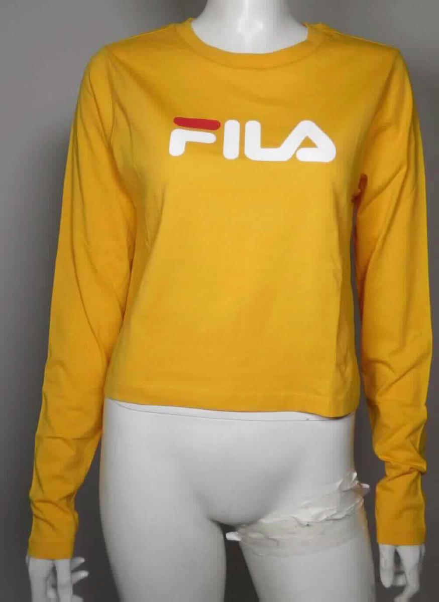 T-Shirt, sogenanntes Shirt FILA UL WMN Marceline, Größe M, Foto siehe Anlage,
- in einem Polybeutel verpackt,
- aus ca. 0,5 mm dicken (leichten), einfarbigen Gewirken aus laut Antrag 100 % Baumwolle,
- über die Taille reichend (Rückenlänge: ca. 50,5 cm),
- mit einem runden, halsnahen Ausschnitt mit einer Randeinfassung,
- ohne Öffnung und ohne Verschluss,
- mit langen, enganliegenden Ärmeln,
- mit einem Aufdruck verziert, 
- am unteren Rand und an den Ärmelenden durch Umschlagen und Festnähen gesäumt.

"T-Shirt, aus Gewirken, aus Baumwolle"