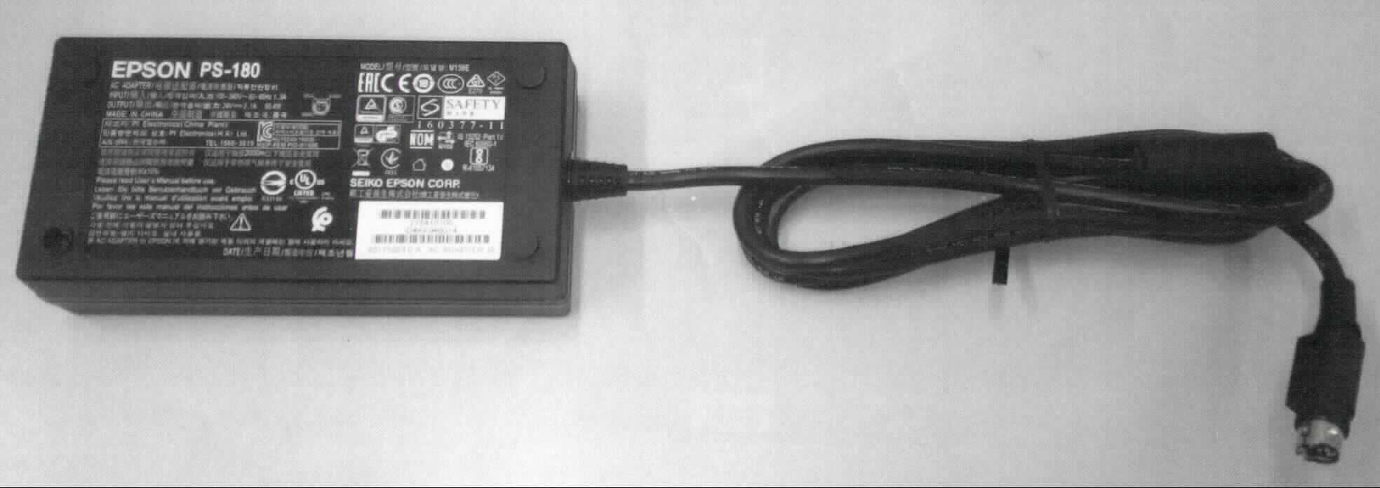 Elektrischer Gleichrichter,
- aus einer mit aktiven und passiven Bauelementen bestückten gedruckten Schaltung in einem Gehäuse 
  (Abmessungen ca. 132 x 32 x 67 mm) mit einem Kaltgeräteeinbaustecker (IEC-60320 -C14) für den Anschluss 
  eines Netzkabels (nicht Gegenstand dieser vZTA-Entscheidung) und einem fest angeschlossenen Kabel mit 
  einem dreipoligen Stecker (Typ Hosiden) zum Anschluss an einen Drucker,
- zum Umwandeln einer Eingangswechselspannung von 100 - 240 Volt (50/60 Hz) in eine Ausgangsgleichspannung 
  von 24 Volt (max. 2,1 A),
- zur Stromversorgung eines an eine automatische Datenverarbeitungsmaschine anschließbaren Bondruckers,
- in einer Folienverpackung verpackt.

Die Ware ist als "elektrischer Stromrichter, von der mit automatischen Datenverarbeitungsmachinen und ihren Einheiten verwendeten Art, nicht für zivile Luftfahrzeuge" einzureihen.