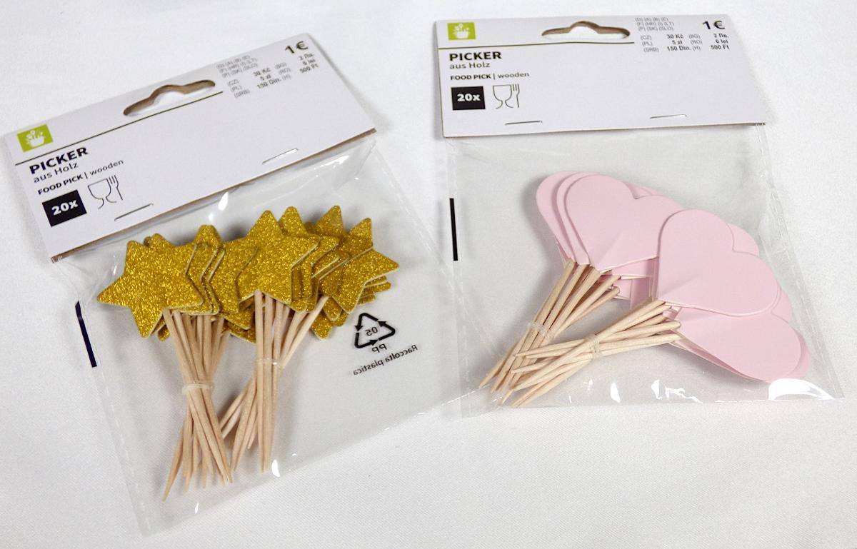 Deko-Picker (Abbildung siehe Anlage)
- gerundete, einseitig angespitzte Spießchen aus Birkenholz,
  am oberen Ende mit kleinen, stern- oder herzförmigen Papier-
  zuschnitten in unterschiedlichen Farben versehen, Länge ca. 8 cm,
- zu 20 Stück für den Verkauf aufgemacht,
- zum Aufspießen von Lebensmittelhäppchen.

Das Holz bestimmt hinsichtlich der Bedeutung für die Verwendung
den Charakter der zusammengesetzten Ware.

"Holzware zur Verwendung bei Tisch oder in der Küche, nicht
aus Bambus, nicht aus tropischem Holz (zusammengesetzte
Ware aus Holz -charakterbestimmend- und Papier)"