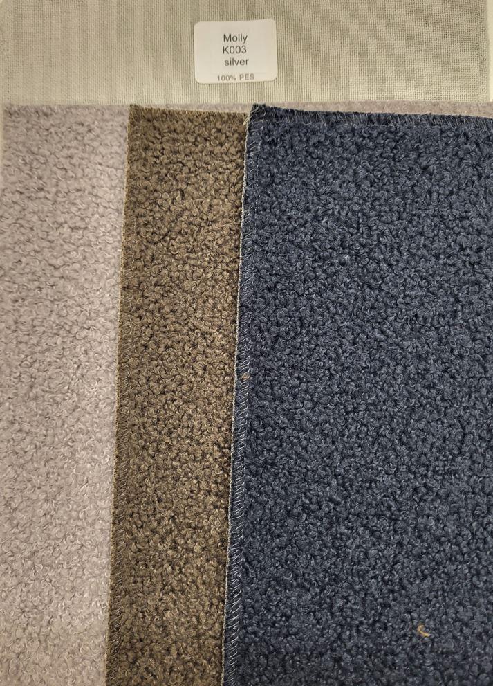 Textillaminat, sog. Buklee-Gewebe zur Verwendung als Möbelbezugsstoff, 
- als Meterware, mit einer Breite von laut Antrag mehr als 30 cm,
- aus zwei mit ihrer ganzen Fläche aufeinander liegenden und so miteinander durch Kleben
  verbundenen Lagen:
-- mit einer Oberlage (Schauseite):
--- aus einem Plüschgewirke aus synthetischen Chemiefasern (laut Antrag Polyester), 
--- kein Hochflorerzeugnis und kein Schlingengewirke,
-- mit einer Unterlage:
--- aus einem Gewebe aus Spinnstoffen,
- das die Schauseite bildende Plüschgewirke verleiht der Ware insbesondere im Hinblick auf die
  Bedeutung in Bezug auf die Verwendung als Möbelbezugsstoff ihren wesentlichen Charakter.

"Plüsch, gewirkt, anderer als in der Unterposition 6001 10 genannte, aus Chemiefasern"