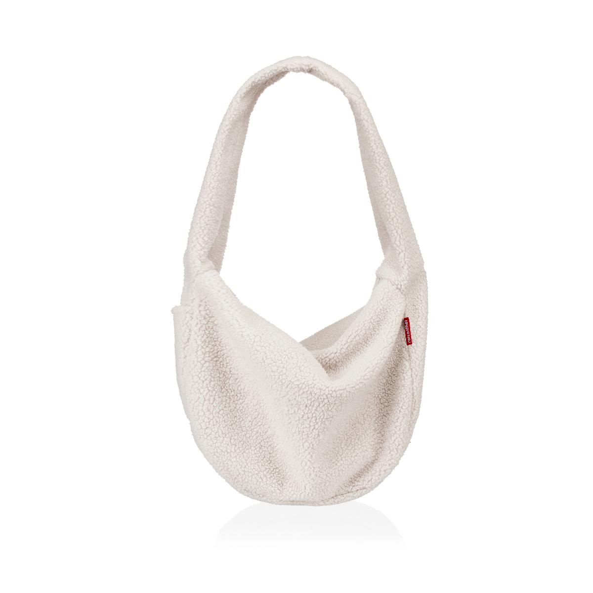 Umhängetasche, Foto siehe Anlage,
- mit einer Außenseite aus Spinnstoffen (laut Antrag 100 % Polyester),
- - in zwei Ausführungen (laut Antrag Cord- oder Teddy-Stoff),
- mit einem Tragegurt aus dem Taschenmaterial,
- an einer Schmalseite mit einem offenen Einsteckfach,
- an der Rückseite mit einem eingesetzten Reißverschlussfach,
- das Hauptfach ist mit einem entlang des oberen Rands verlaufenden Reißverschluss versehen,
- - gefüttert; innen mit einem offenen Einsteckfach ausgestattet,
- mit den Abmessungen: ca. 62 cm (Breite) x 41 cm (Höhe) x 13 cm (Tiefe),
- ohne Hinweise auf Handarbeit,
- keine Einreihung als Handtasche aufgrund der Größe.

"Ähnliches Behältnis, anderes als in den Unterpositionen 4202 1110 bis 4202 3900 genannte, 
 mit Außenseite aus Spinnstoffen, anderes als in der Unterposition 4202 9291 genannte, 
 nicht handgearbeitet"