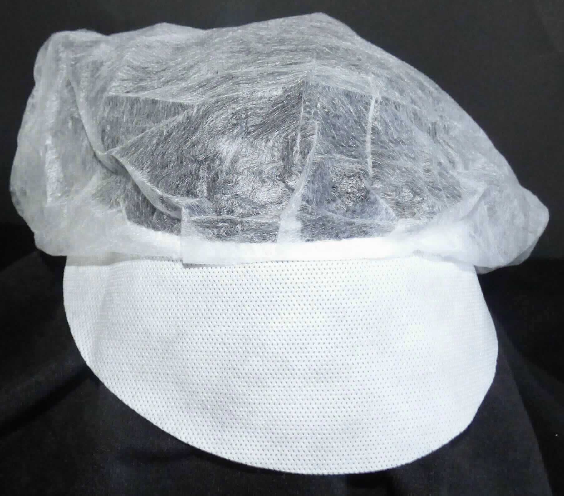 Kopfbedeckung, sog. Barett-Haube mit Schirm, Foto siehe Anlage, 
- aus einem runden Zuschnitt aus Vliesstoff aus synthetischen Spinnstoffen hergestellt, 
- mit einem maximalen Durchmesser von ca. 50 cm, 
- am gesäumten Rand mit einem eingezogenen, elastischen Gummiband ausgestattet, 
- mit Schirm, 
- zur Verwendung als Schutzhaube zum Bedecken des gesamten Haares.

"Kopfbedeckung, aus einem Stück von Spinnstofferzeugnissen hergestellt, Mütze, mit Schirm"