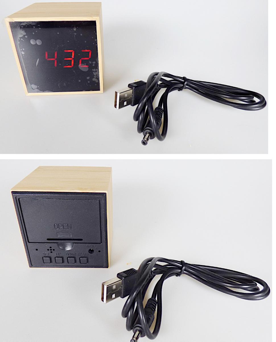 Bei dem Erzeugnis handelt es sich im Wesentlichen um eine zusammengesetzte Ware aus einem Thermometer und einem vom Umfang und Verwendungszweck her charakterbestimmenden, batteriebetriebenen Wecker (kein Kleinuhr-Werk), mit digitaler LED-Anzeige der Uhrzeit (Stunden, Minuten) mit Datum (Tag, Monat) und Temperatur (umschaltbar zwischen Grad Celsius und Grad Fahrenheit), mit Alarmfunktion, eingefasst in einem würfelförmigen großen Gehäuse (Kantenlänge ca. 6,3 cm) aus Bambus. An der hinteren Seite ist das Erzeugnis mit einem Batteriefach mit eingelegter Batterie, einer Steckbuchse für eine externe Stromversorgung und vier Bedientasten ausgestattet.

Der Wecker ist zusammen mit einem USB-Kabel in einem Pappkarton verpackt.

Die Ware ist als "andere als in den Positionen 9101 bis 9104 erfasste Uhr, Wecker, elektrisch betrieben" einzureihen.
