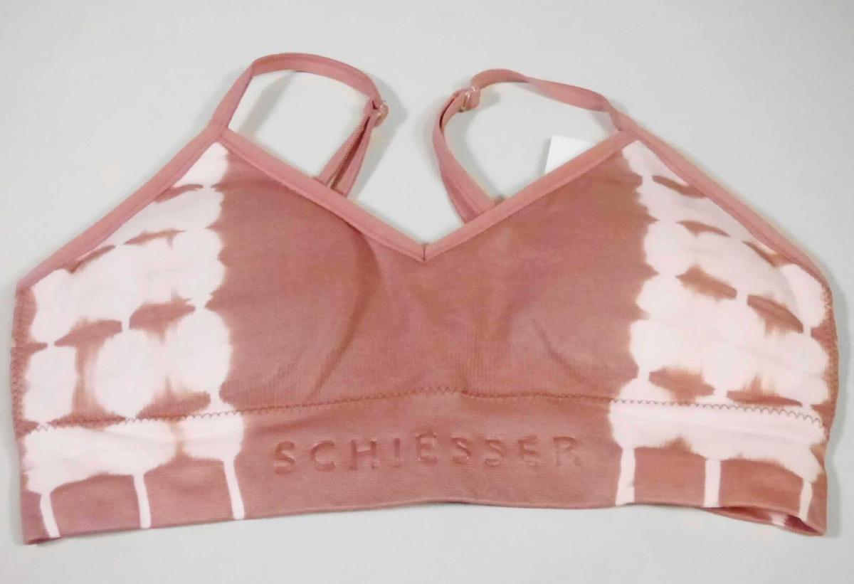 Bustier, sog. Damenbustier, Art.-Nr. 165585, Größe S, Foto siehe Anlage,
- aus ca. 0,7 mm dicken, bedruckten Gewirken aus laut Antrag 95 % Polamid und 5 % Elasthan (beides
  synthetische Chemiefasern),
- bis kurz unter die Brust reichend (Rückenlänge: ca. 23 cm), 
- mit schmalen, aus der oberen Randeinfassung gebildeten, längenverstellbaren Trägern,
- ohne Öffnung und ohne Verschluss,
- im Brustbereich doppelt gearbeitet und mit herausnehmbaren Polstern versehen,
- am unteren Rand verengend gearbeitet,
- ohne ausgearbeitetes Büstenteil; das Kleidungsstück ist nach Schnitt und Ausstattung nicht dazu bestimmt, die 
  Einzelbüste zu stützen, zu formen oder zu korrigieren (somit keine Ware der Position 6212).

"Andere Kleidung (Bustier), aus Gewirken, aus Chemiefasern "