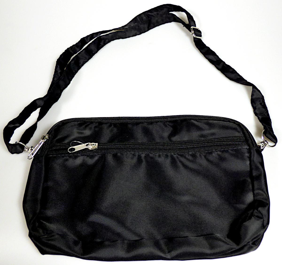 Handtasche, sog. Umhängetasche, Foto siehe Anlage,
- mit einer Außenseite aus Spinnstoffen,
- mit einem abnehmbaren, längenverstellbaren Schultertragegurt,
- mit einem eingesetzten Vorfach mit Reißverschluss,
- das Hauptfach ist mit einem entlang des oberen Randes bis zu den Seiten verlaufenden
  Reißverschluss versehen,
- - gefüttert; ohne Inneneinteilung,
- mit den Abmessungen: ca. 22 cm (Breite) x 15 cm (Höhe) x 5 cm (Tiefe),
- ohne Hinweise auf Handarbeit,
- Handtasche, da aufgrund der Größe und des Gesamteindrucks in erster Linie dazu geeignet,
  kleinere, persönliche Gegenstände aufzunehmen.

"Handtasche, mit Außenseite aus Spinnstoffen, nicht handgearbeitet"