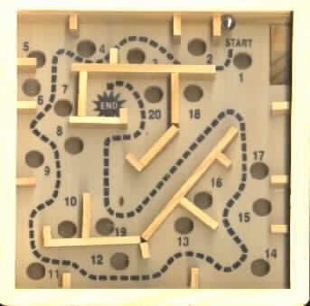Puzzle aus Holz, nicht handgearbeitet, sog. Labyrinth.

Bei der Ware handelt es sich um ein Geschicklichkeitsspiel aus Holz, in Form eines ca. 12,5 x 12,5 x 3 cm großen Holzkästchens mit durchsichtiger Kunststoffscheibe. In dem Kästchen ist eine mit Löchern und kleinen Holzwänden versehene Holzplatte befestigt. Auf der Platte ist schwarz ein Weg von "Start" bis "End" vorbei an den Löchern eingezeichnet. Die Löcher sind nummeriert.
Ziel des Spiels ist es durch geschicktes Bewegen des Kästchens eine im Kästchen befindliche Metallkugel vom "Start" zum "End" zu bringen, ohne dass die Kugel in eins der Löcher fällt.

Ein Bild der Ware ist im Internet unter http://ec.europa.eu/taxation_customs/dds/ebticau_de.htm zu finden