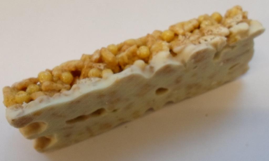 Varen er en tilberedt sprød fødevare bestående af en blanding af fuldkorn og vitaminer, formet i 25 g barer.
Varen er ifølge det oplyste et morgenmadsprodukt/snack.
Ifølge det oplyste er varen fremstillet ved sammenblanding af alle ingredienser, formet i firkantede stykker, ristet og derefter overtrukket med olie og overdrysset med en blanding af sukker, kanel og andre ingredienser.
Varen sælges i pakker á 150 g, indeholdende 6 barer á 25 g.