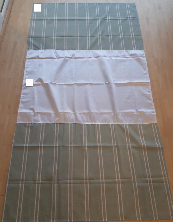 Varens samlede mål er W 2.000 x L 1.400 mm, hvoraf W 700 x L 1.400 mm udgøres af satin. Den resterende del af varen består af polycotton (bomuld og polyester). Tekstilstoffet af satin er skinnende og blankt, hvorimod tekstilstoffet af polycotton er mat og forsynet med tryk i form af striber.
Varen er et lagen af vævet tekstilstof syet i tre baner af hhv. satin og bomuld/polyester. Lagenets centrale del udgør et lavfriktionsområde. Varen er et fleksibelt tekstilprodukt, der fungerer som hjælpemiddel for selvhjulpne brugere i sengen.
Varen er fremstillet af to forskellige tekstiltyper bestående af hhv. bomuld/polyester (polycotton) og polyester (satin).
