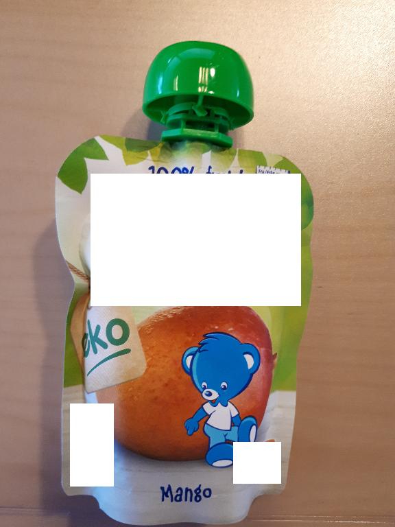 Varen foreligger som en fin, ensartet og homogen, orange frugtmos uden stykker i. Konsistensen er meget fin og tynd. Den kan spises med ske.
Den dufter syrligt af mango.
Det er oplyst, at varen er beregnet som børnemad til børn fra 4 måneder og opefter.
Ifølge produktspecifikationen indeholder varen mangopuré og citronjuicekoncentrat.
Næringstabellen angiver følgende: fedt, kulhydrater, heraf også sukkerarter, kostfibre og protein.
Varen foreligger i detailsalgsemballage, indeholdende 90 g nettovægt.