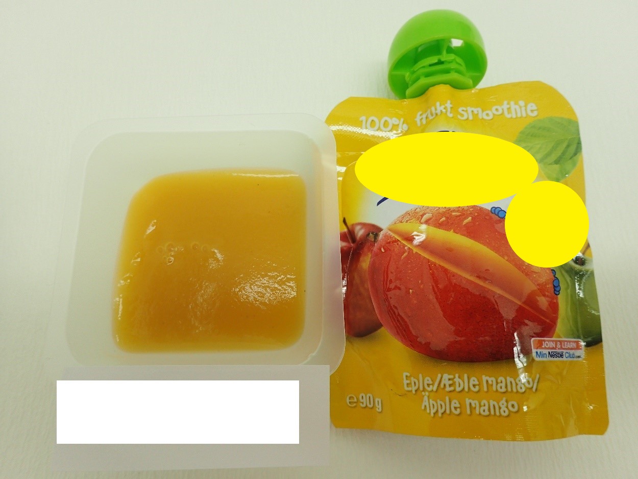 Varen er en fin, ensartet frugtmos uden frugtstykker. Varen har en mørk orange farve, dufter sødt og smager af mango.
Varen kan presses ud på en ske eller spises direkte fra emballagen.
Det er oplyst, at varen kan anvendes som børnemad til børn fra 6 måneder.
Varen består ifølge det oplyste af æble, mango og C-vitamin.
Næringstabellen angiver, at varen indeholder fedt, kulhydrater, heraf sukkerarter, kostfibre og protein.
Varen er pakket i en trykt folieklempose med skruelåg, indeholdende 90 g.
