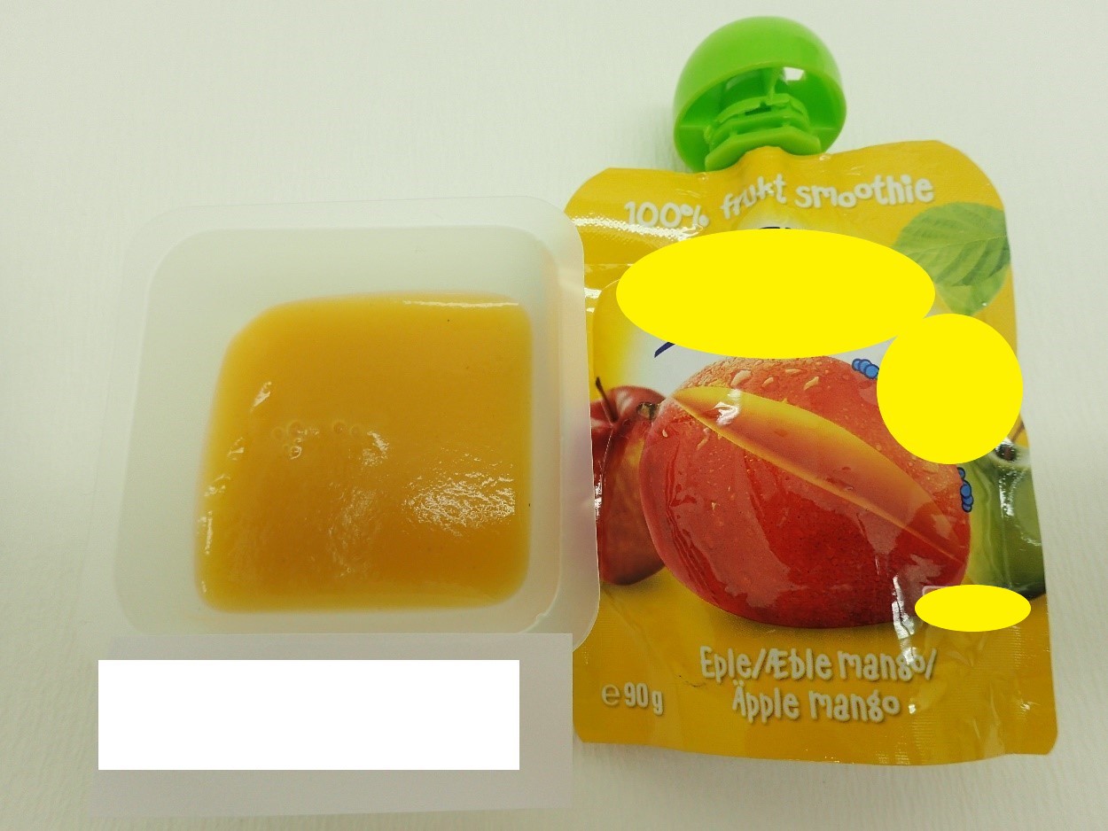 Varen er en fin, ensartet frugtmos uden frugtstykker. Varen har en mørk orange farve, dufter sødt og smager af mango.
Varen kan presses ud på en ske eller spises direkte fra emballagen.
Det er oplyst, at varen kan anvendes som børnemad til børn fra 6 måneder.
Varen består ifølge det oplyste af æble, mango og C-vitamin.
Næringstabellen angiver, at varen indeholder fedt, kulhydrater, heraf sukkerarter, kostfibre og protein.
Varen er pakket i en trykt folieklempose med skruelåg, indeholdende 90 g.