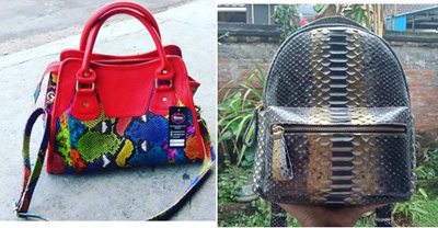Bolso de mano con superficie exterior de piel de serpiente pitón.  Dispone de cremallera, asas y bolsillo interior. Está realizado a mano.