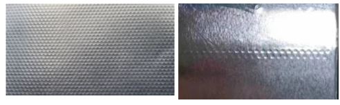 Hojas de aleación de aluminio con grosores superiores o iguales a 0.009 mm e inferiores a 0.021 mm. Se presentan en rollos con un peso comprendido entre los 11 y los 400 kg y una anchura comprendida entre los 100 y los 500 mm.
Estas hojas presentan un trabajo de gofrado que puede haberse realizado en toda su superficie o a intervalos regulares para marcar las zonas de corte de la hoja. 
Según declaración de solicitante este gofrado se realiza por medio de una maquina gofradora que desenrolla la hoja de aluminio, la hace pasar entre dos rodillos gofradores con el patrón de grabado a realizar y la rebobina una vez gofrada.
