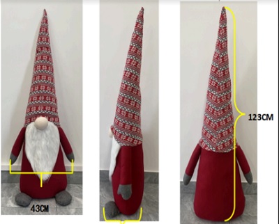 Juguete, muñeco relleno (gnomo), con rostro cubierto con una gran barba. 
El gorro, cabeza, nariz, barba, brazos y cuerpo están rellenos de poliéster. Los pies están rellenos de piedras pequeñas. Tiene una altura de 123 cms.
Juguete para el entretenimiento de niños.