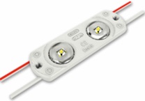 Elemento de iluminación en forma de módulo. Está compuesto por dos diodos emisores de luz (LED) con lentes ópticas y sendas resistencias superficiales soldadas en un circuito impreso. Su potencia es de 0,5 W, de 0,8 W O 1,6W. Funciona con una tensión de 12 V en corriente continua y se presenta provisto de cables de conexión en ambos extremos.
Dispone en la parte posterior de una capa adhesiva cubierta por una lámina desechable.
Presentan diferentes dimensiones según el modelo.
Ofrece varias opciones de montaje: atornillado, pegado o encajado a presión.
Función y uso:
Según declaración del solicitante se utiliza en iluminación, estando diseñado para su uso en cajas de luz cerradas o en el cuerpo de rótulos.