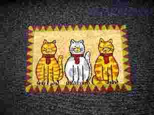 TAPIS GENRE PAILLASSON, DE FORME RECTANGULAIRE, DIMENSION 60 CM X 40 CM, COMPOSE DE FIBRES DE COCO IMPLANTEES VERTICALEMENT SUR UN SUPPORT EN CAOUTCHOUC (LATEX).