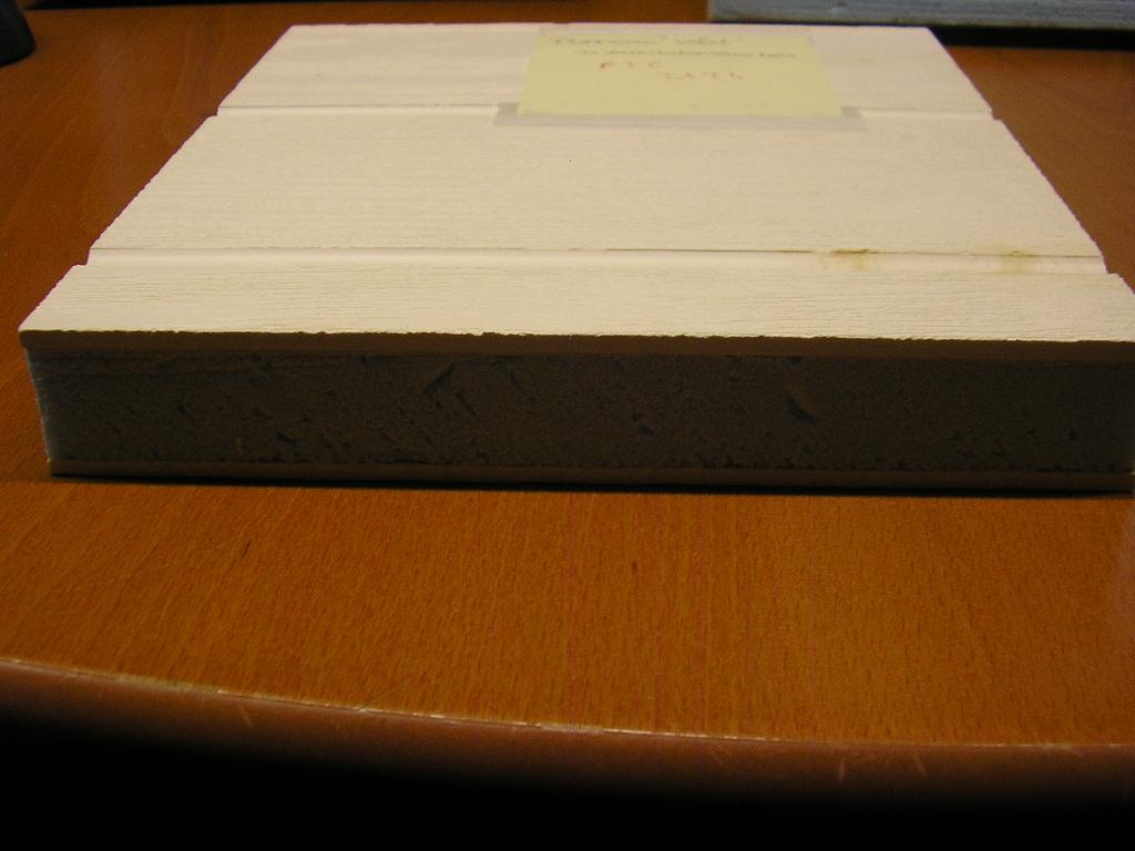 OUVRAGE COMPOSITE SE PRÉSENTANT SOUS LA FORME D'UN PANNEAU ISOLANT.
CE PANNEAU POSSÈDE UNE ÂME EN POLYSTYRÈNE EXTRUDÉ ALVÉOLAIRE,ENCADRÉE DE DEUX PLAQUES EXTÉRIEURES EN MATÉRIAUX COMPOSITES A BASE DE FIBRE DE VERRE ET DE RÉSINE DE POLYESTER DONNANT UN ASPECT "FAUX BOIS".

CE PANNEAU EST DESTINÉ A LA RÉALISATION DE VOLETS.