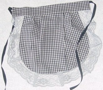 WOVEN APRON.  WITH LACE STYLE TRIM ALONG EDGE.   WITH TIES FOR FASTENI
NG AROUND THE WAIST. 100% COTTON.  PACKED WITH SCARF, SKIRT AND BLOUSE
 OF DIFFERENT FABRICS ALL CLASSIFIED SEPARATELY.