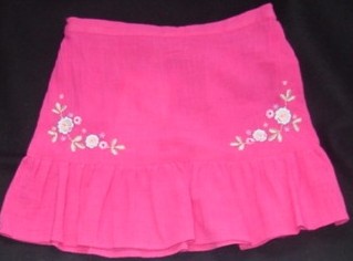A WOVEN CRINKLE COTTON SKIRT FOR GIRLS. WITH A HALF ELASTICATED WAISTB
AND. WITH A FRILL TO LOWER HALF. HEMMED AT BASE OF GARMENT. HALF LINED
. WITH EMBROIDER AND BEADS TO FRONT. RASPBERRY COLOUR PLAIN DYED.
