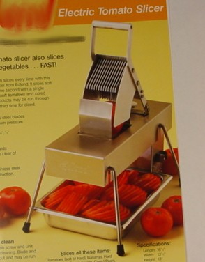 A 110/240 VOLTS,  ELECTRIC TOMATO SLICER.  CONSTRUCTED IN STAINLESS STEEL WITH STAINLESS STEEL CUTTING BLADES.  LENGTH 16.5 INCHES, WIDTH 13.5 INCHES, HEIGHT 13 INCHES AND WEIGHT 20LBS.