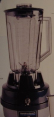 A 120V BLENDER, CONSTRUCTED OF ZINC ALLOY PAINTED BASE IN GREY, WITH BLACK PLASTIC COVER.  A 44 OUNCE POLYCARBONATE CONTAINER WITH A BLACK PLASTIC LID, WEIGHT 8LBS AND HEIGHT 14 3/4 INCHES.  FOR COMMERCIAL USE.