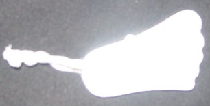 PUMICE STONE INTENDED TO BE USED IN BATHROOM FOR MANICURE AND PEDICURE PURPOSES. SHAPED LIKE A FOOT,  WITH SINGLE HOLE DRILLED AT THE HEEL END. WITH PLAITED CORD LOOP THREADED THROUGH THE HOLE, SO THAT THE ITEM CAN BE HUNG. PRESENTED AND PACKAGED FOR RETAIL SALE IN CLEAR PLASTIC FILM. PART OF A SET IN A WIRE BASKET WITH OTHER ITEMS CLASSIFIED SEPARATELY.